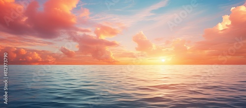 Copy space image of a stunning sea sunset with majestic clouds as the sun sets over the ocean s horizon photo