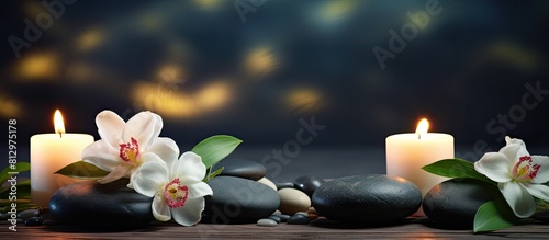 A table adorned with burning candles spa stones and flowers providing ample copy space for additional text