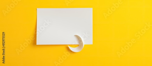 A white paper with a question mark is shown against a vibrant yellow background The image leaves space for additional content or text photo