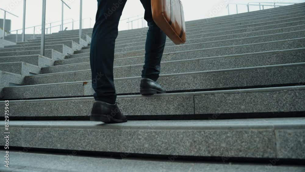 Top view of smart business man walking up stairs with bag in the hand. Professional project manager climb up the stair and going to workplace. Increasing skill, getting promotion, traveling. Exultant.