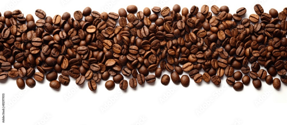 White background with roasted coffee beans and the word COFFEE Copy space image available White background with roasted coffee beans and the word COFFEE Copy space image available