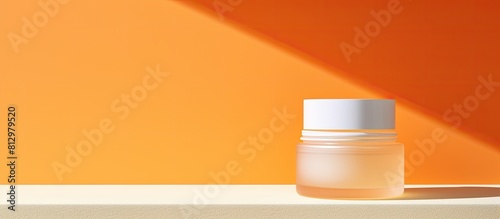 A jar of sunscreen a tube of SPF cream and a bright orange background showcase the importance of skin care and protection against UV rays The image also emphasizes the effects of photoaging There is photo