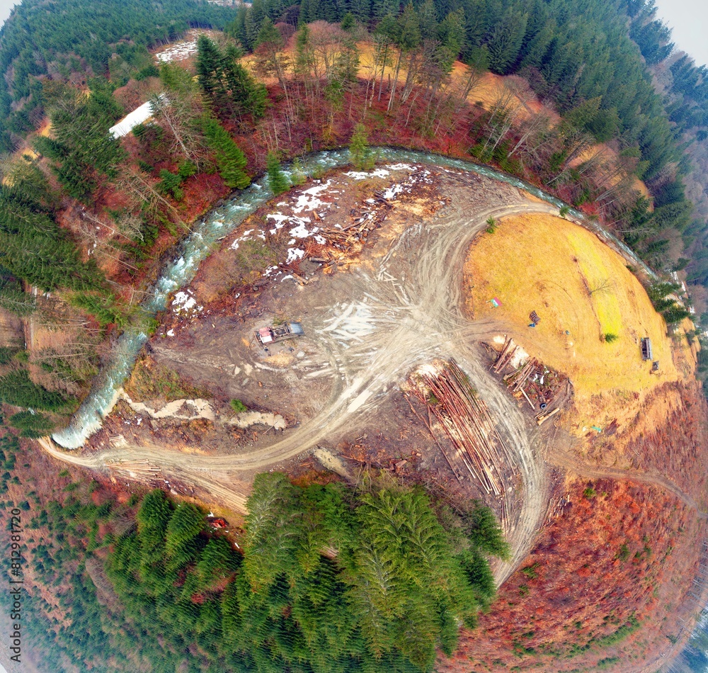 Carpathian forest clearing and an all-terrain vehicle tractor