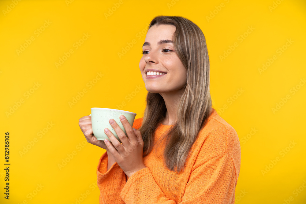 Happy emotions concept. Positive and beautiful young woman in studio cup of coffee Happy emotions concept. Positive and beautiful young woman in studio cup of coffee