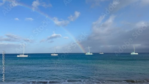 Beautiful complete rainbow at the west shore of Maui at sunrise, Hawaii