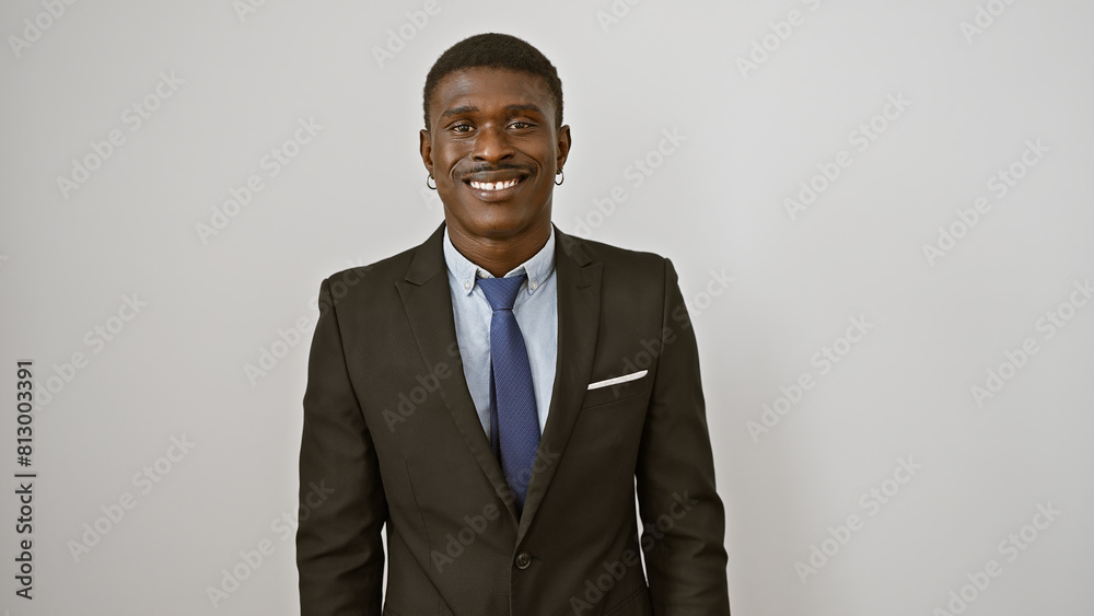 Handsome businessman in a suit smiling against a white background Handsome businessman in a suit smiling against a white background