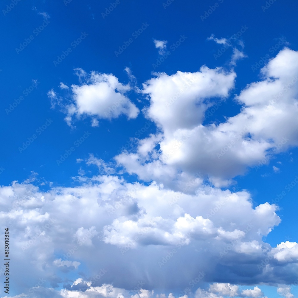 Obraz premium Blue sky background with tiny clouds. Beautiful nature scene with copy space