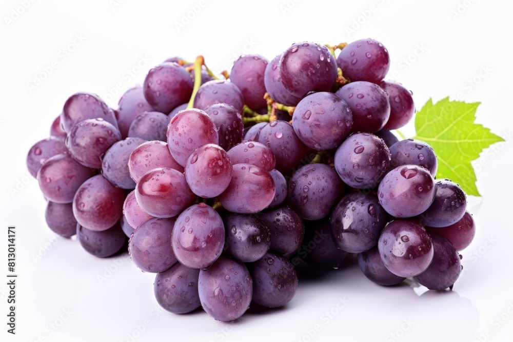 Fototapeta premium A bunch of fresh, ripe grapes with a green leaf.