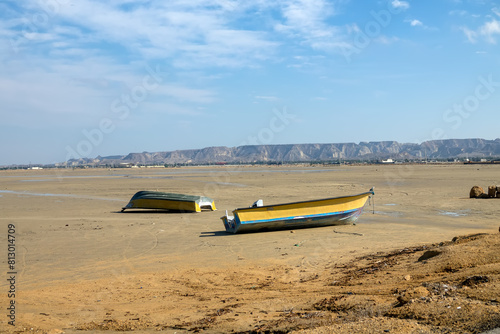 Fishing boats at the bottom of the bay (cove) at low tide, equinoctial springs (syzygy). Qeshm Island, Iran photo