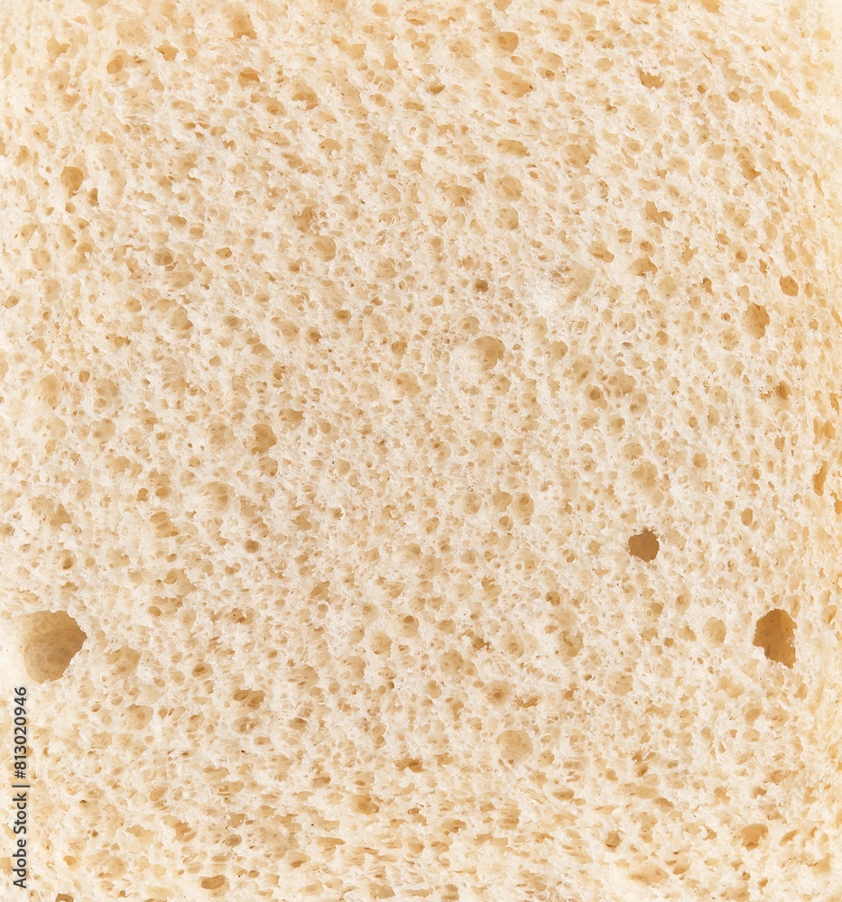 Close-up texture of a sliced white bread highlighting its porous structure and baked color. Close-up texture of a sliced white bread highlighting its porous structure and baked color.