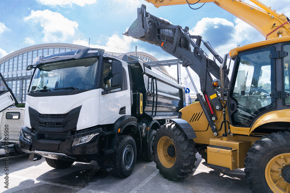 Heavy construction machines during a work Heavy construction machines during a work