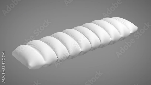 Wavy pillow inflated on green screen background.