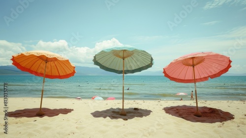 Colorful Chinese paper parasols for shade at the sunny beach. summer day