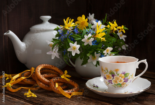 Tea with bagels. Still life in vintage style with spring flowers