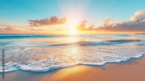 Peaceful beach scene with the sun setting on the horizon, casting a warm glow over the sand and water