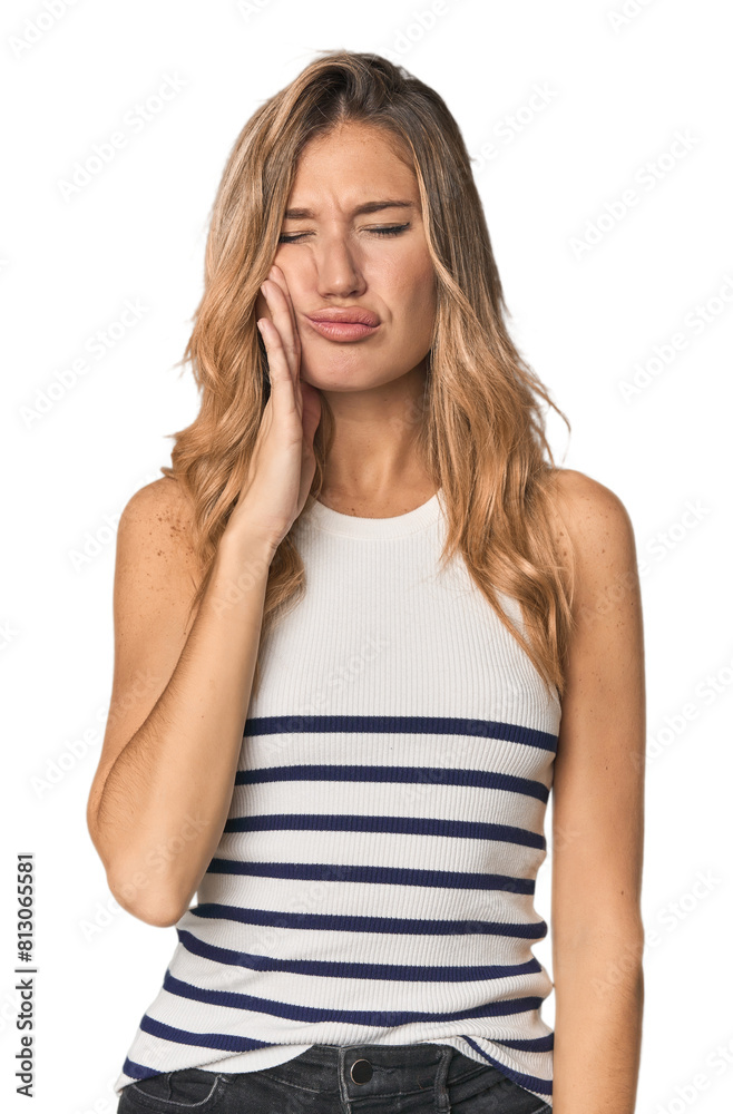 Caucasian blonde woman in studio having a strong teeth pain, molar ache. Caucasian blonde woman in studio having a strong teeth pain, molar ache.
