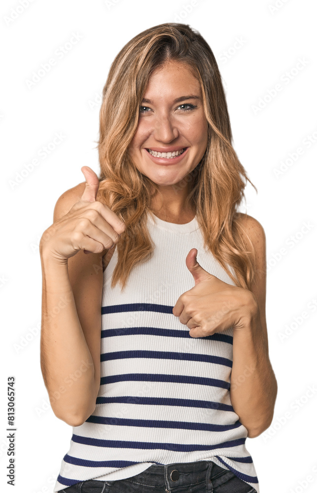 Caucasian blonde woman in studio raising both thumbs up, smiling and confident. Caucasian blonde woman in studio raising both thumbs up, smiling and confident.
