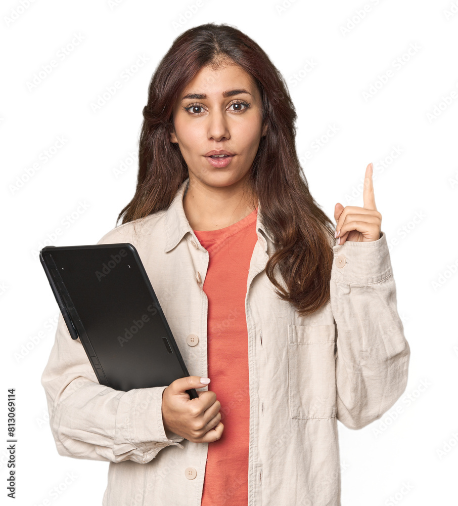 Middle Eastern woman with graphic tablet having some great idea, concept of creativity. Middle Eastern woman with graphic tablet having some great idea, concept of creativity.
