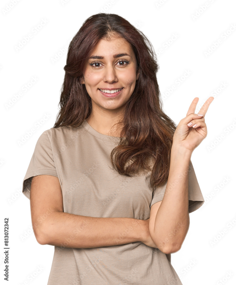 Middle Eastern woman in studio showing number two with fingers. Middle Eastern woman in studio showing number two with fingers.