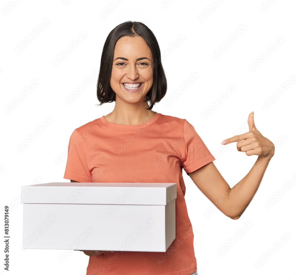 Young Caucasian woman holding a white box person pointing by hand to a shirt copy space, proud and confident Young Caucasian woman holding a white box person pointing by hand to a shirt copy space, proud and confident