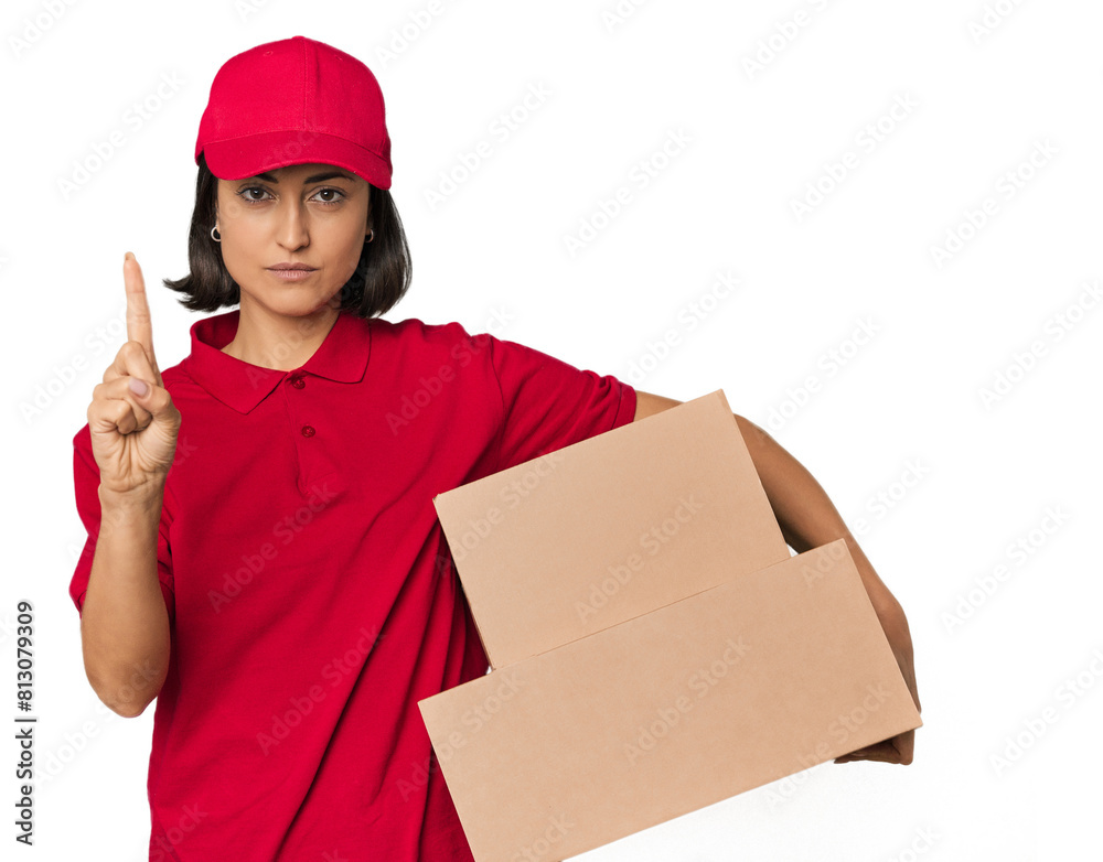 Young Caucasian delivery woman with boxes showing number one with finger. Young Caucasian delivery woman with boxes showing number one with finger.