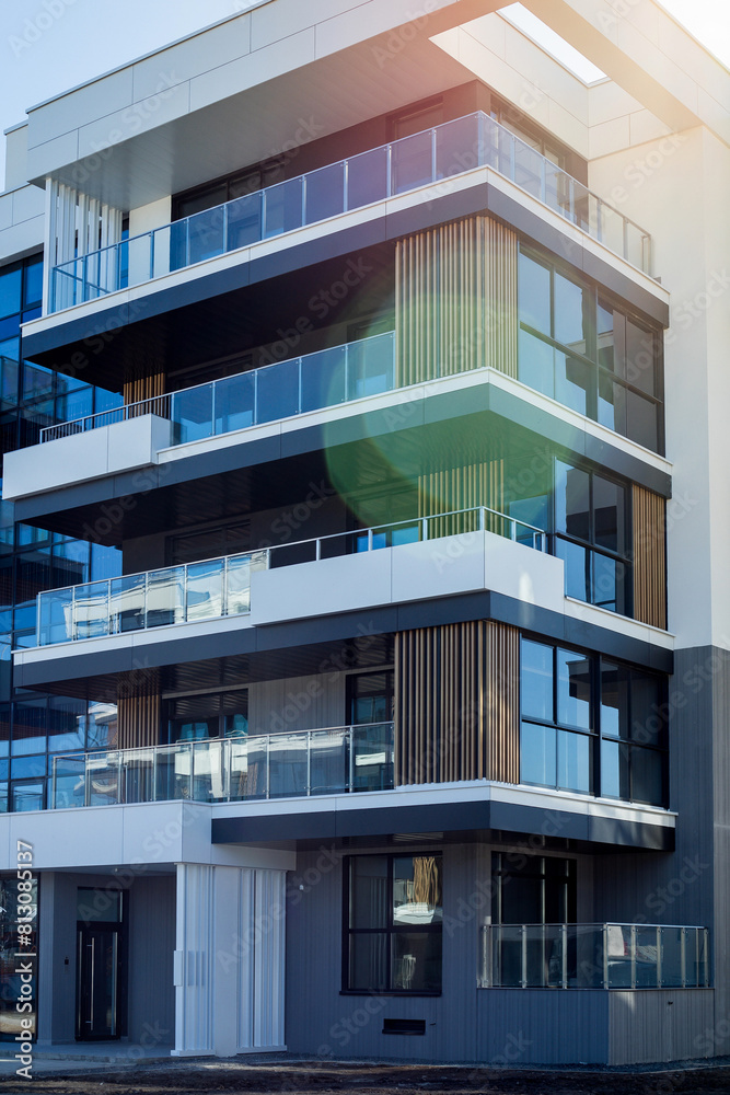vertical photo of a building with luxury apartments with a sunbeam vertical photo of a building with luxury apartments with a sunbeam
