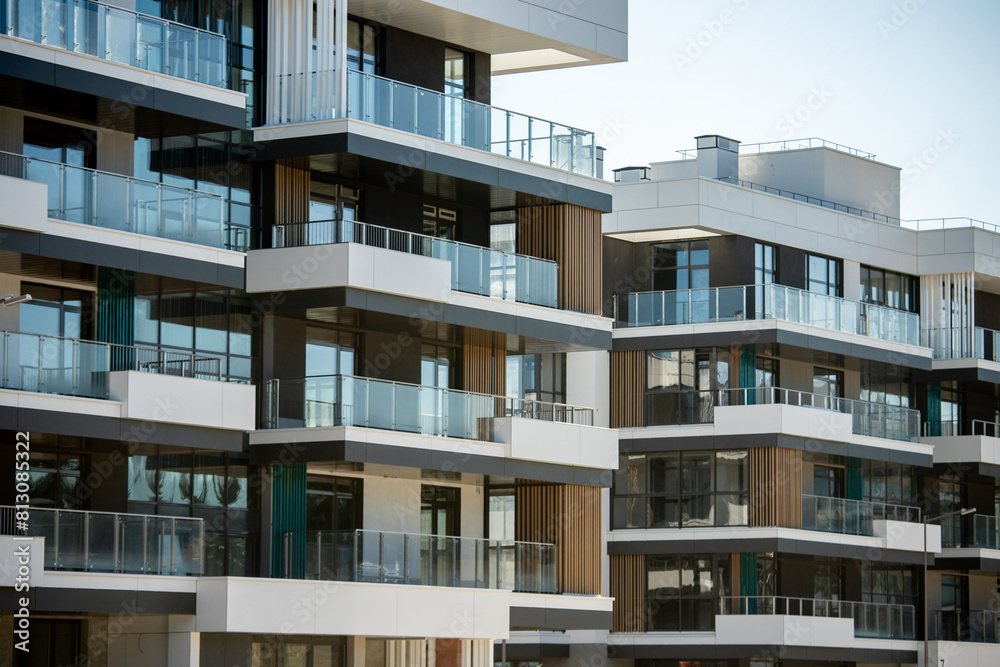 Luxurious apartments for sale. High block of flats living area. New build neighborhood modern style. Real estate market in Europe Luxurious apartments for sale. High block of flats living area. New build neighborhood modern style. Real estate market in Europe