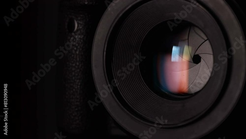 Close-up optical close-up black DSLR camera with closed iris diaphragm blades cine lens