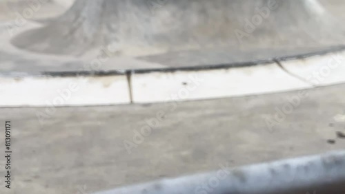 Public playground for a skateboard in a recreation park. No people.