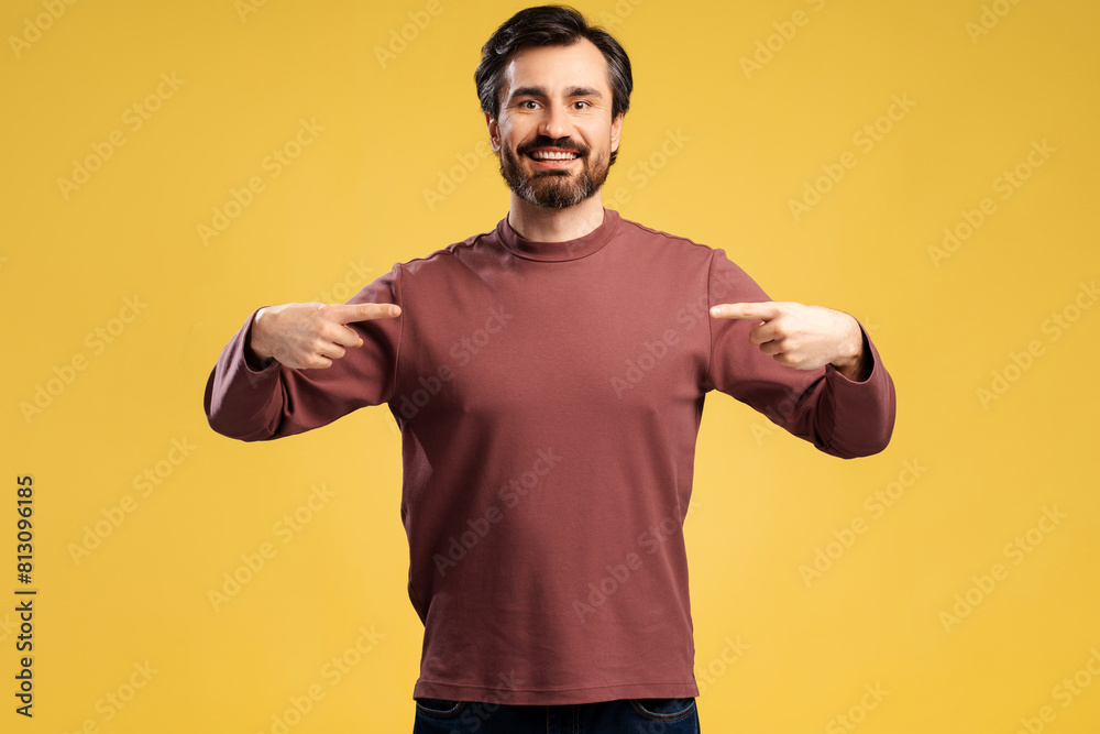 Smiling man in casual pointing fingers to himself, looking at camera, isolated Smiling man in casual pointing fingers to himself, looking at camera, isolated