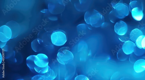 Abstract blue light rays background with glowing bokeh lights and lens flare, energy beams in the style of motion