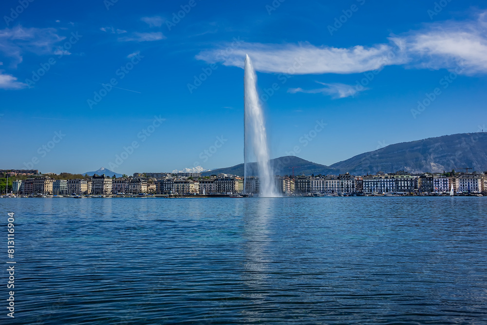 Beautiful view of the water Jet Fountain (Jet d'Eau fountain, 140 meters) in the lake of Geneva (Lac Leman). GENEVA, SWITZERLAND.
