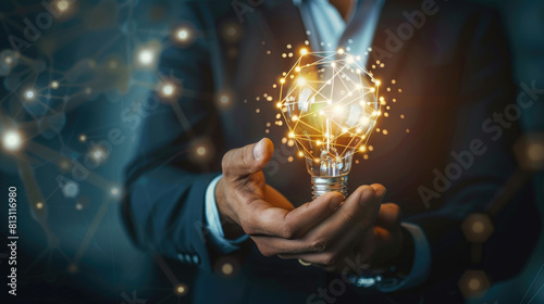Hand Businessman holding illuminated lightbulb  idea  innovation and inspiration  smart business intelligent creativity with bulbs