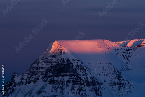 Iceland. Snowy mountain sunset