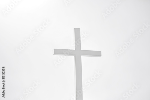 Simple white cross on white background