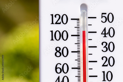 Outdoor thermometer in the sun during heatwave. Hot weather, high temperature and heat warning concept.