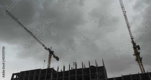 Cuadro en lienzo The building cranes rotates from the wind