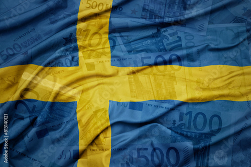 waving colorful national flag of sweden on a euro money banknotes background. finance concept.