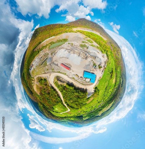 Carpathian Mountains of Ukraine, a quarry where granite sandstone is mined for the production of building materials, powerful trucks and conveyors load gravel - video from a drone Spherical 360 