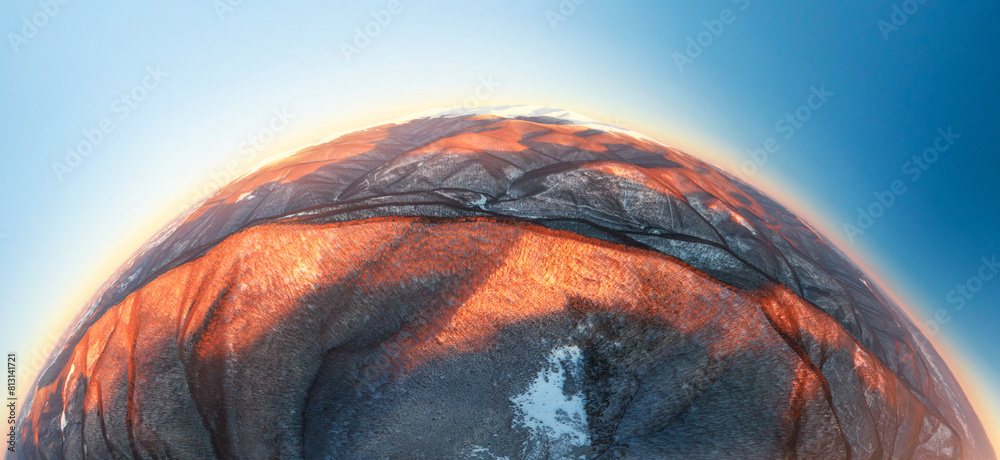 drone flies over the peaks of the mountainous Carpathian region with a winter color pattern of snowy beech trees on the tops, river valleys painted with sunset flames Spherical 360 panorama