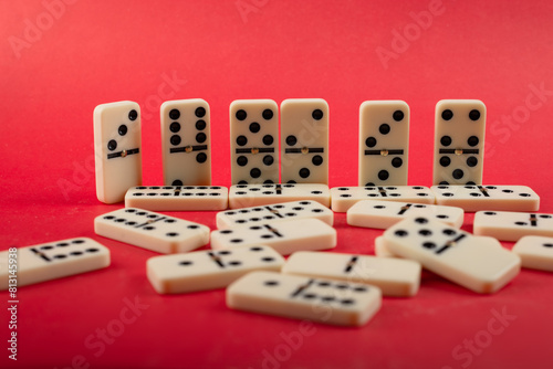 Dominoes on a red background. photo