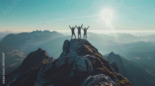 Together overcoming obstacles with three people holding hands up in the air on mountain top , celebrating success and achievements