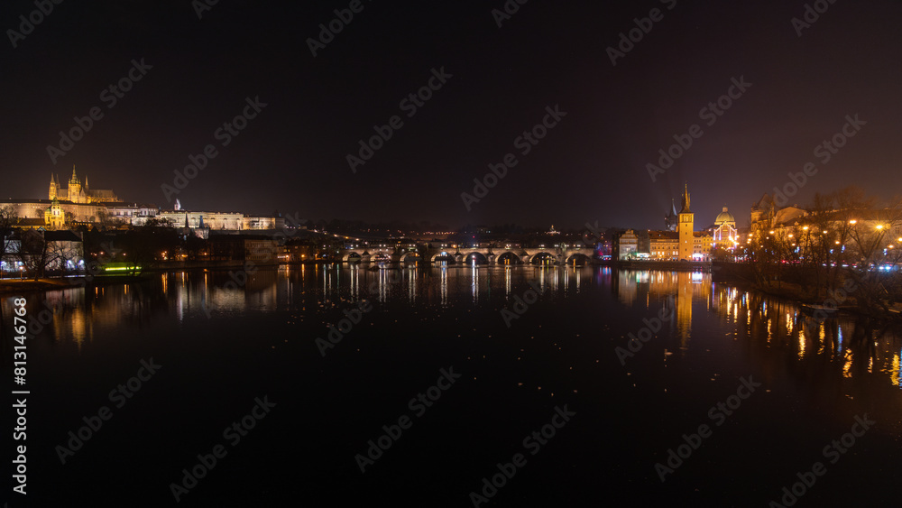 Illuminated Hradcany (Prague Castle)  and Charles Bridge,  St. Vitus Cathedral and St. George church, medieval architecture, Vltava river at night, Bohemia, Czech Republic.