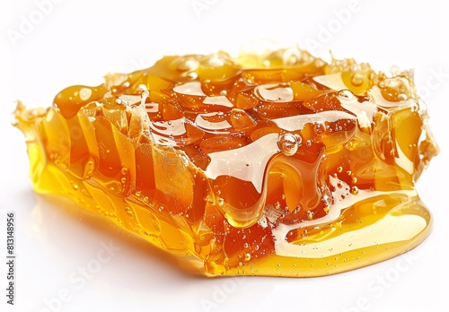 Translucent Honeycomb Slice with Drops of Liquid Honey