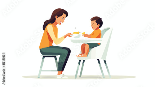 Mother feeding her son sitting in baby high chair c