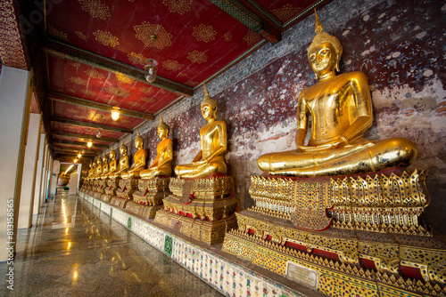 Many of the Buddha in a row at Wat Suthat Thepwararam, Wat Sao Chingcha or Giant Swing temple, One of the major tourist attractions in Bangkok in Thailand photo