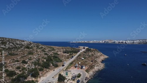 Aerial view of Mistra battery from Mistra bay. Qawra aquarioum and Bugibba promenade in the distance. . High quality FullHD footage photo