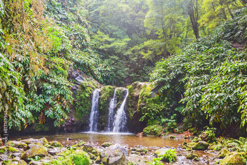 Majestic waterfall in lforest at Sao Miguel island, Portugal