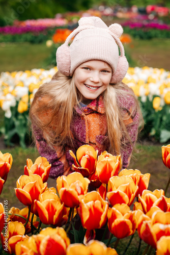 portrait of a child against a background of flowers