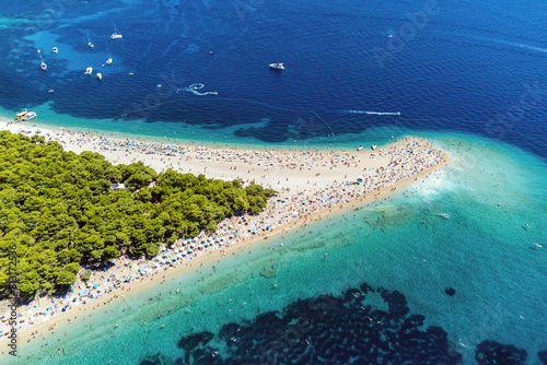 Fototapeta Naklejka Na Ścianę i Meble -  Aerial photo of the breath taking Zlarni rat beach in Bol on Brac island in Croatia